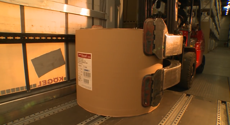 Putting Paper Reel Down In Trailer