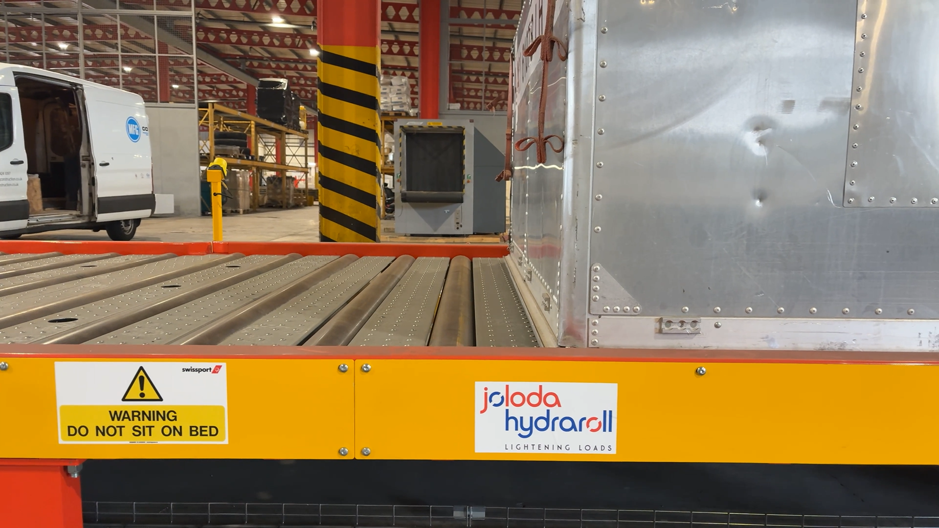 ULD Moving Along Powered Rollerbed From Truck Dock